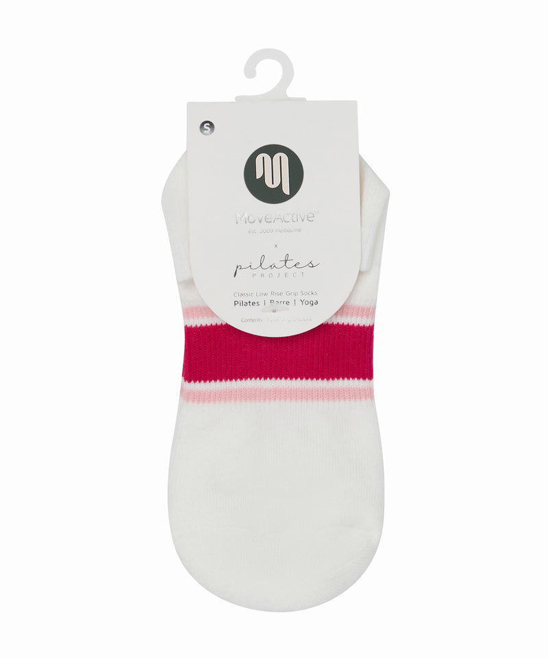 Pair of classic low rise grip socks in playful pink stripes, perfect for yoga, pilates, and barre workouts