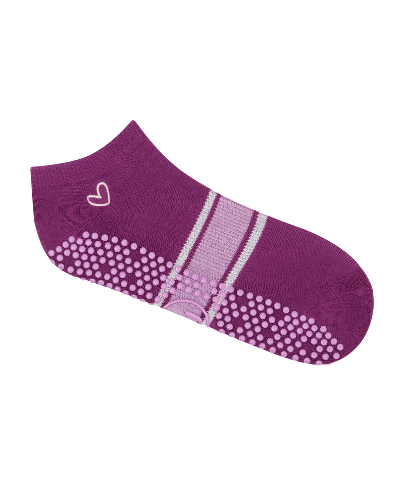 Woman wearing Classic Low Rise Grip Socks in Dahlia Stripes during yoga practice